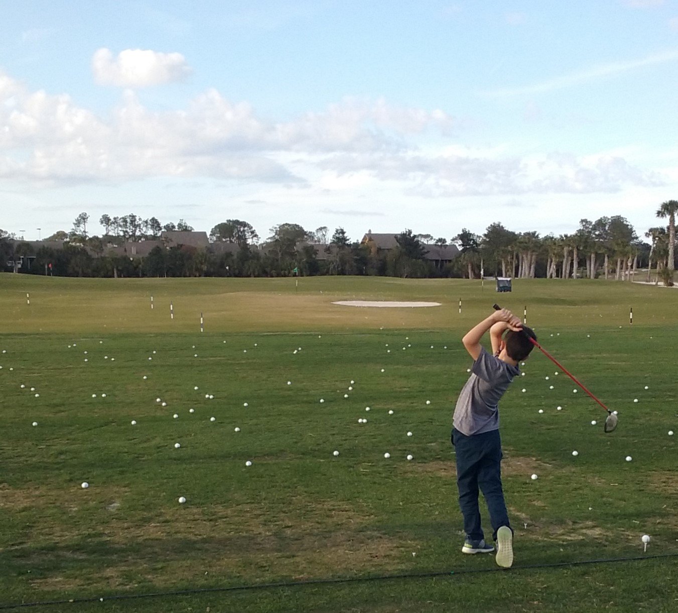 A young golfer demonstrates his skill on the driving range during the Tesori Family Foundation All-Star Kids Clinic on March 10.